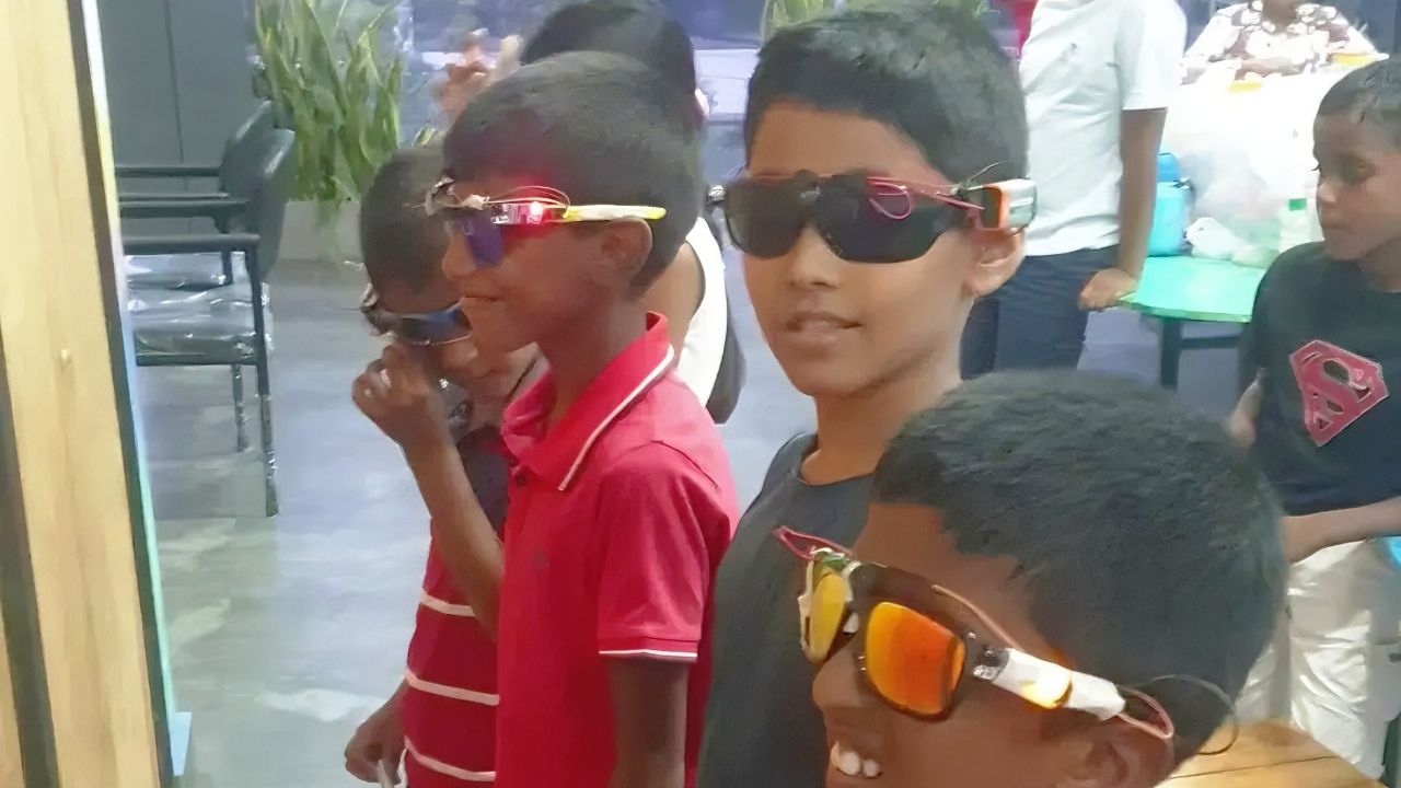 Students wearing LED glasses they built in Galle