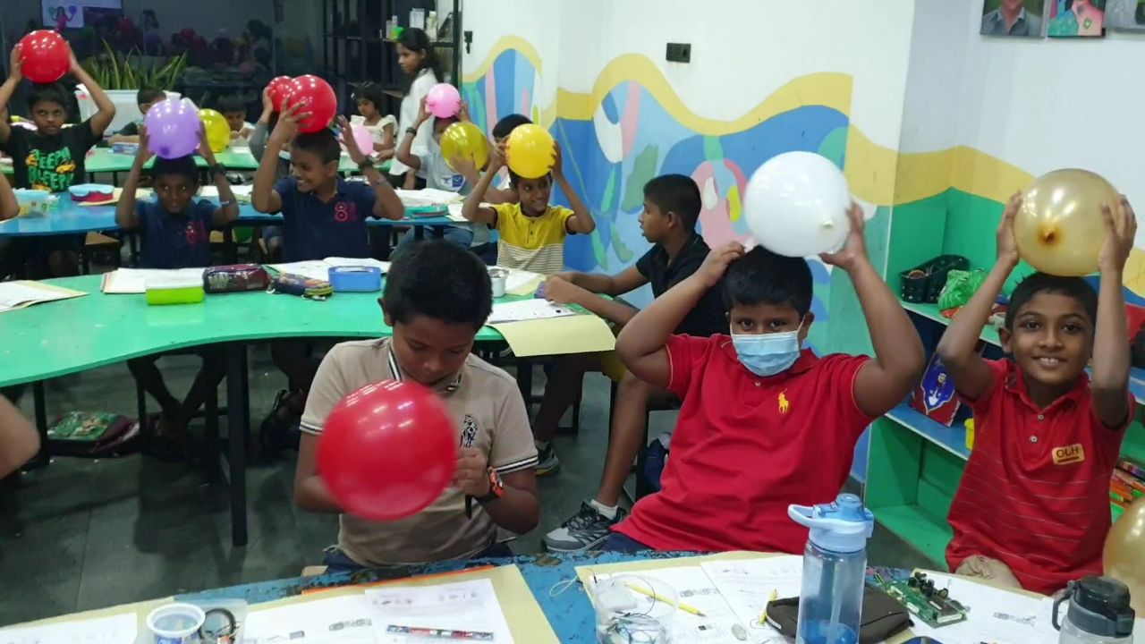 Students experimenting with balloons in class